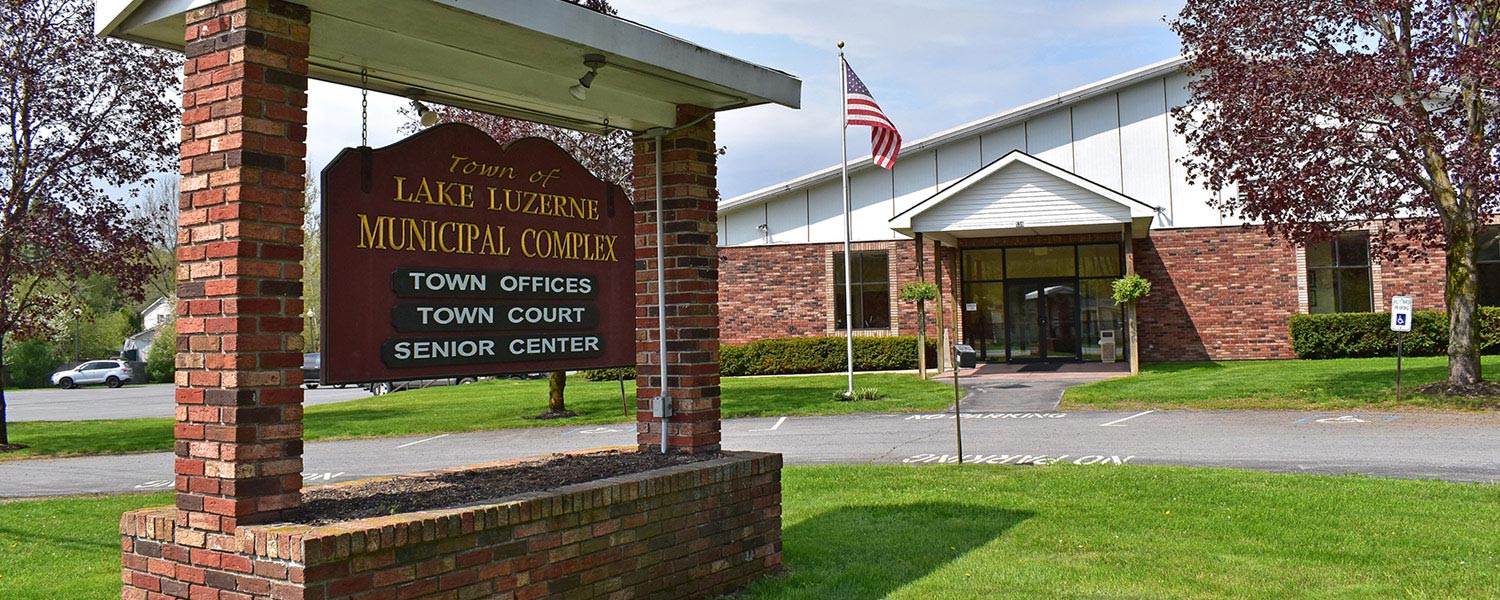 Image of the Lake Luzerne Town Hall in the sunshine, where the Assessor's office is located.
